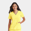 A women’s v-neck top in vibrant yellow with contrast detailing and a subtle logo.