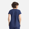 A navy women's top with short sleeves and a back pleat design, featuring three pockets and a branding logo.