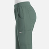 A pair of women's jogger pants in a muted green colour, featuring side pockets and an elastic waistband.