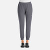 A pair of women's joggers in a grey colour, featuring an elastic waistband and side pockets. The joggers have a logo.