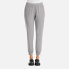 A pair of grey women's joggers with a streamlined design and elastic waistband, featuring side pockets.