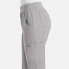 A pair of light grey women's joggers with pockets and an elastic waistband, featuring a branded logo.