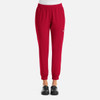 A pair of women's joggers in vibrant red with an elasticated waist and cuffs, featuring side pockets and a logo.