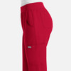 A red jogger pant with an elastic waistband and side pockets, featuring a small logo on the pocket.