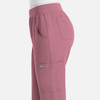 A pair of pink women's joggers featuring side pockets and an elastic waistband, with a small logo.