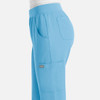 A pair of light blue women's jogger pants featuring an elastic waistband and side pockets, with a small logo.