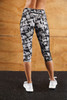 A pair of grey and black patterned 3/4 tights with a logo, suitable for women's activewear.