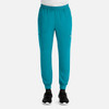 A pair of men's joggers in teal with an elastic waistband and side pockets. Features a logo on the leg.