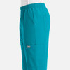 Full elastic jogger in teal, featuring side pockets and a logo on the thigh.