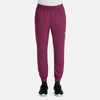 A pair of men's full elastic joggers in a deep burgundy colour, featuring side pockets and a waistband.