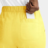 A pair of yellow women's cargo pants featuring a full elastic waistband and a pocket with a phone partially placed inside.