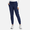 Navy jogger pants with a drawstring waist and side pockets, paired with a long-sleeved top and trainers.