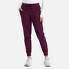 A pair of women's joggers in a rich plum colour, featuring a tie waist and fitted cuffs.