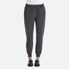 A pair of women's joggers in dark grey with a fitted waist and cuffs, featuring pockets and a branding logo.