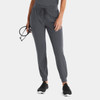 A pair of women's jogger pants in dark grey with elastic cuffs and a drawstring waist, held by a model with glasses.