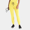 A pair of bright yellow women's jogger pants with a drawstring waistband, featuring a logo and worn with black sneakers.