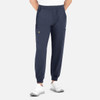 A pair of navy joggers with a full elastic waistband and side pockets, worn by a model.