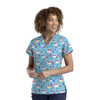 A V-neck print top in blue featuring colourful ice cream designs. The shirt has a logo on it.