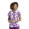 A women's v-neck top with a purple and white tie-dye print, featuring a short-sleeve design and a logo.