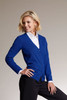 A blue ladies V-neck cardigan with buttons, worn over a white shirt and styled with black trousers.
