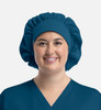 A unisex bouffant cap in teal, designed for uniforms, worn by a person smiling. The cap features a logo.