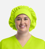 A unisex bouffant scrub cap in bright lime green fabric, featuring a gathered design.