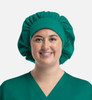 A unisex bouffant scrub cap in teal, designed for medical or uniform use, worn by a smiling individual.