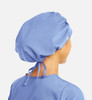 A blue unisex bouffant cap with a tied back, suitable for uniforms or medical use.