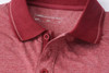 A men's heather polo shirt in a rich burgundy colour with a classic collar and button placket, featuring a logo.