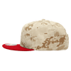 A camo snapback cap featuring a beige patterned body and a red flat brim, with a logo on the side.