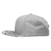 A grey camo snapback cap with a structured high profile and a curved brim. It features a logo on the side.