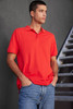 A men's polo shirt in vibrant red, featuring a collar and a logo, paired with casual denim jeans.