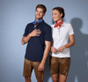 A navy blue polo shirt and a white polo shirt on a man and woman, both wearing neck scarves and shorts.