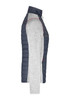 A knitted hybrid jacket in navy and light grey, featuring a zip front and a logo on the chest.