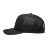 A black 6-panel mid-profile structured trucker cap with a mesh back and curved visor. Features a logo on the front.