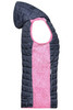 A knitted hybrid vest featuring a pink front and navy back with a hood. The design includes quilted sections and a logo.