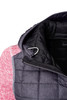 A knitted hybrid jacket featuring a black quilted hood and red body, with a zippered collar and an attached hook.