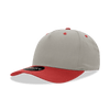 A mid-profile, structured cap in grey with a red brim and buttons, featuring a logo on the front.
