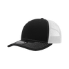 A black and white 6-panel mid-profile structured trucker cap featuring contrasting stitching and a mesh back.