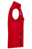 A red softshell vest featuring a side pocket and a ruffled armhole design. It has some branding details.