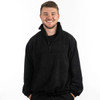 A black 1/4 zip polar fleece pullover worn by a smiling man, featuring a high collar and relaxed fit.
