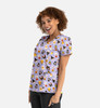 A women's v-neck top in purple featuring a playful print of various Halloween-themed designs, with a logo on the side.