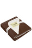 A brown and cream fleece blanket, neatly folded and wrapped with a band, featuring a textured edge and a logo.