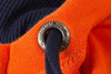 An orange and navy zip-hoodie featuring a metal eyelet for the drawstring.