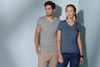 A grey and a navy women's heather T-shirt are displayed on models against a light blue background. The shirts have v-neck designs.