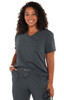 A woman wearing a grey top paired with grey pants, featuring a logo and a stylish, comfortable design.