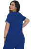 A woman is wearing a blue short-sleeved top, showing the back view. The top has a logo.