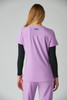 A purple top featuring short sleeves and a black long-sleeve underlayer. It includes a logo on the back.