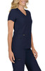 A navy medical top with a V-neck and short sleeves, featuring two front pockets and a logo.