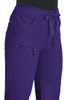 A pair of purple pants featuring pockets and a tie waist, with a small logo on the side.